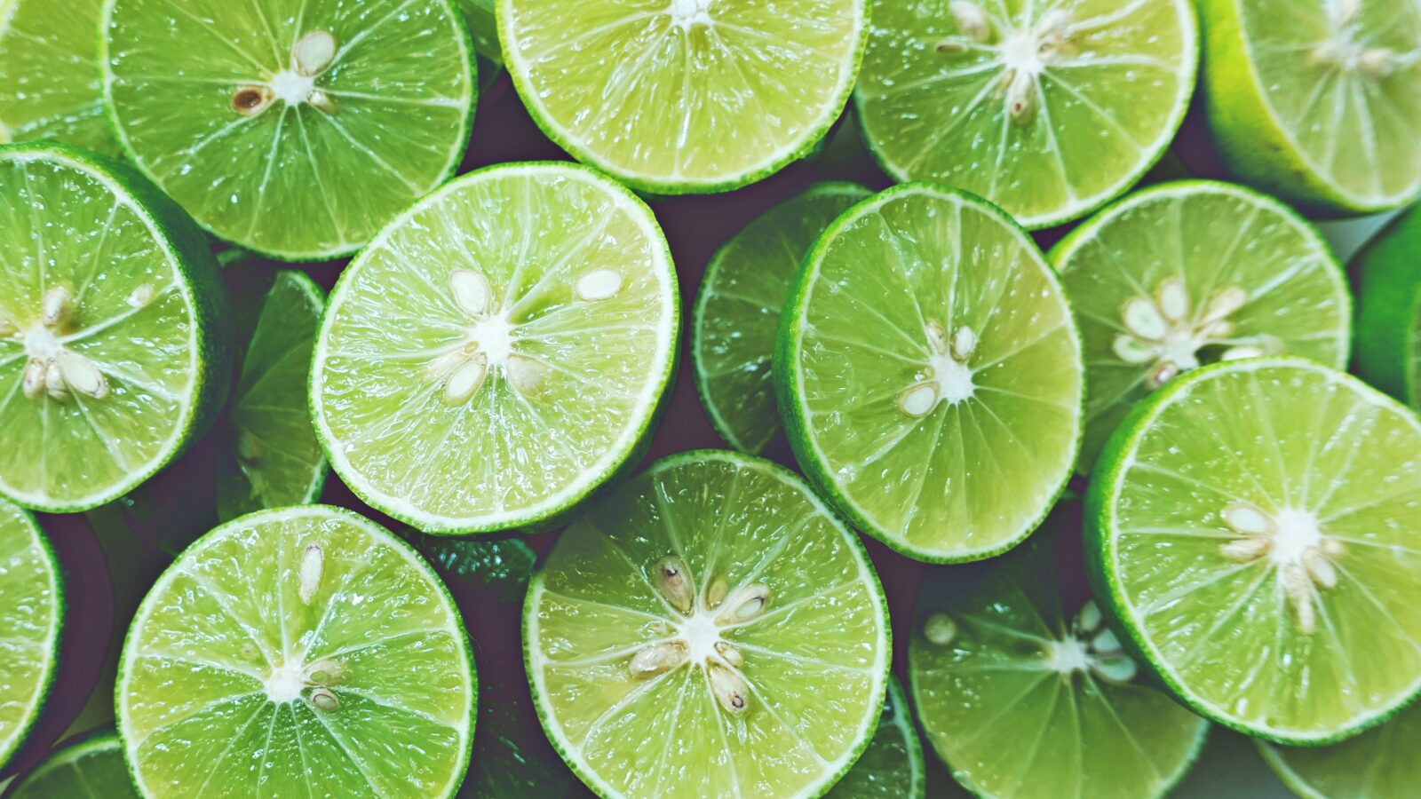 Lime Background. Close up shot of limes. Selective Focus of slic