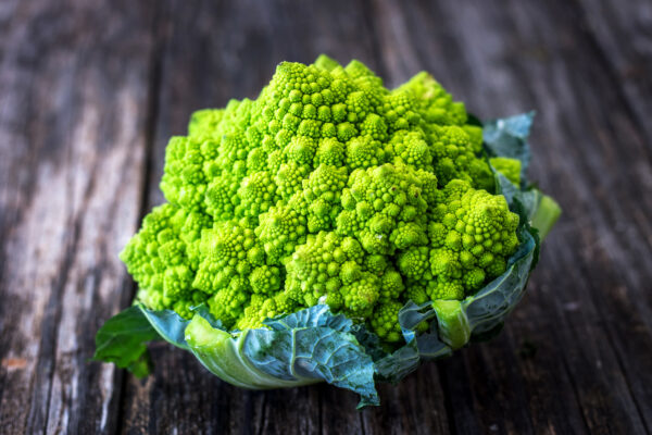 Romanesco cauliflower on wooden background